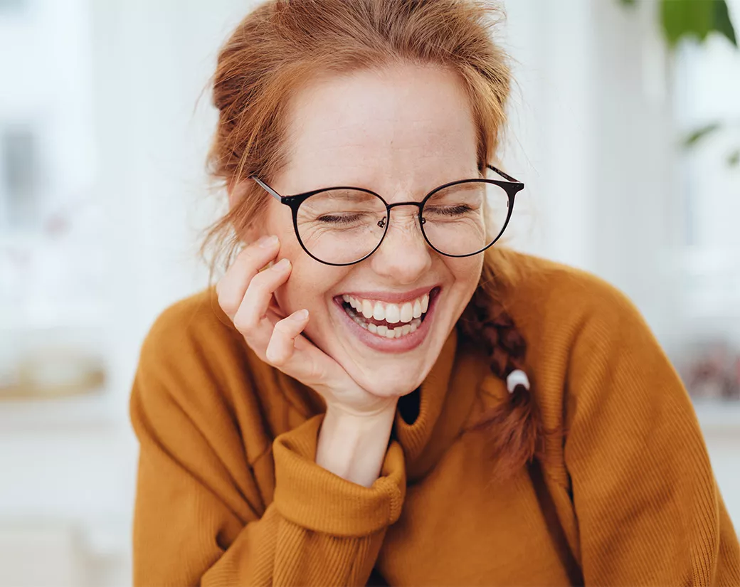 Woman in glasses smiling